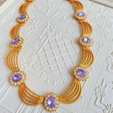 Collana Reale con Cristalli Viola e Dettagli Dorati - Come Moon 